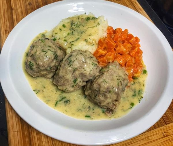 Meatballs in dill sauce, fried carrot, and mashed potato
